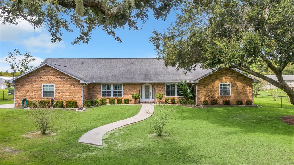 4147 Boggy Creek Road Kissimmee, FL 34744 - Photo 26 of 49 front view of a house with a yard