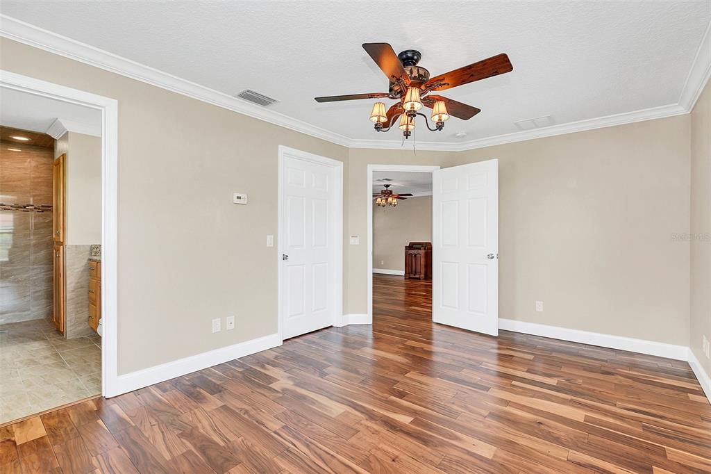 4147 Boggy Creek Road Kissimmee, FL 34744 - Photo 32 of 49 wooden floor in an empty room with a window