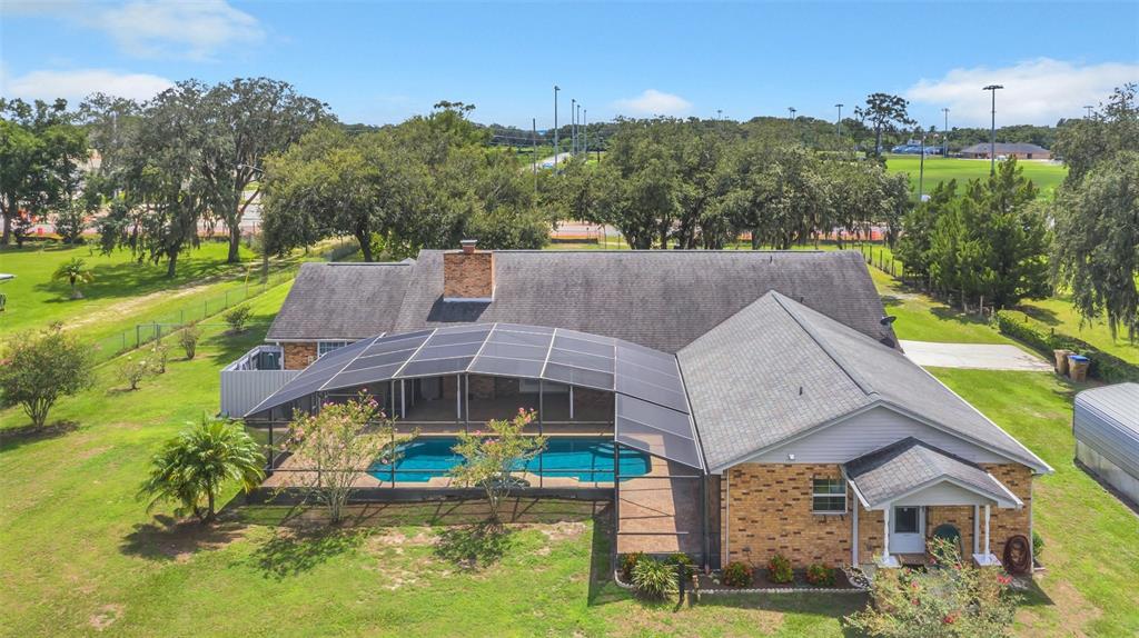 4147 Boggy Creek Road Kissimmee, FL 34744 - Photo 4 of 49 an aerial view of a house with a big yard