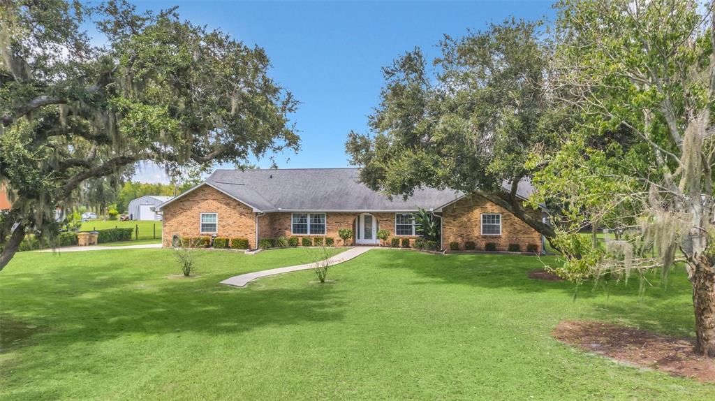 4147 Boggy Creek Road Kissimmee, FL 34744 - Photo 49 of 49 front view of a house with a yard