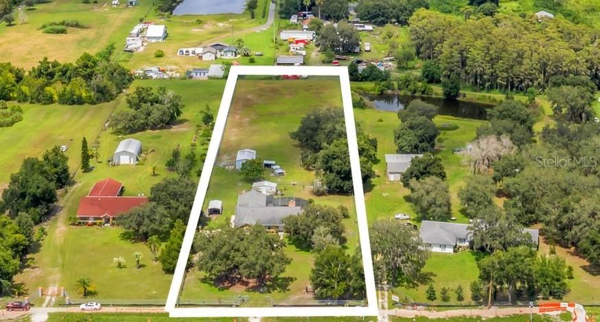 4147 Boggy Creek Road Kissimmee, FL 34744 - Photo 5 of 49 an aerial view of residential houses with outdoor space