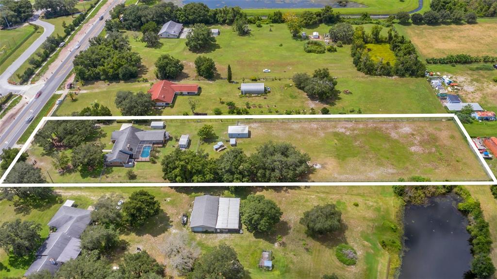 4147 Boggy Creek Road Kissimmee, FL 34744 - Photo 6 of 49 an aerial view of river residential houses with outdoor space