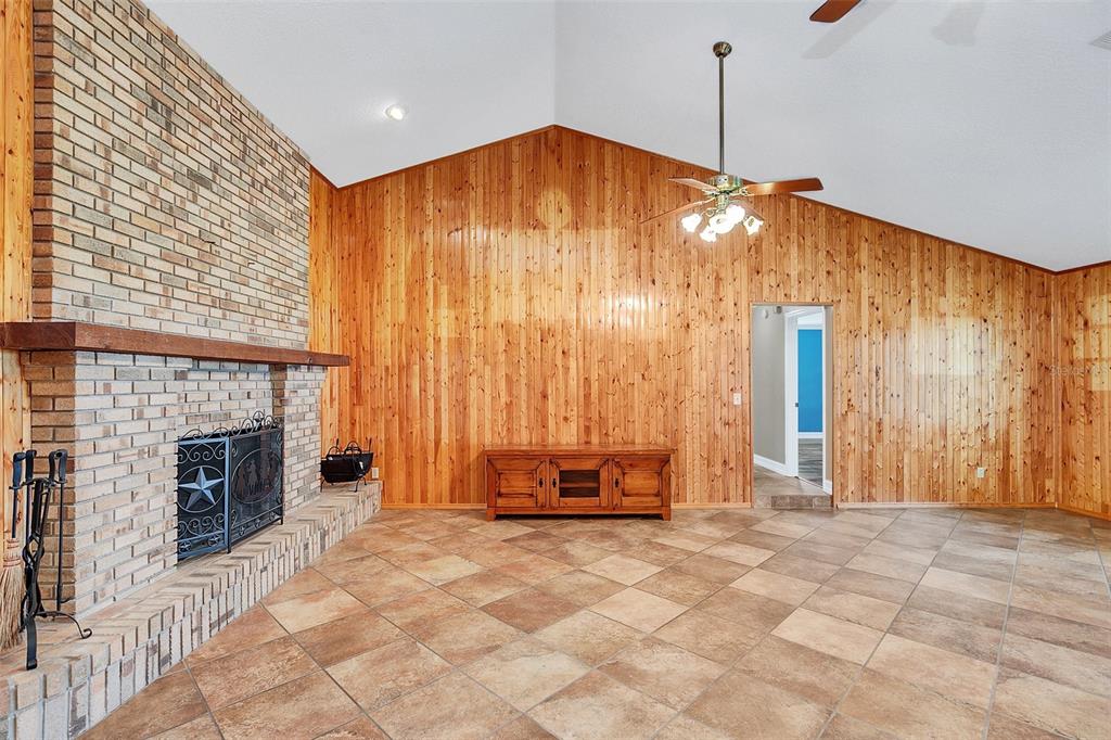 4147 Boggy Creek Road Kissimmee, FL 34744 - Photo 8 of 49 a view of an empty room with a fireplace