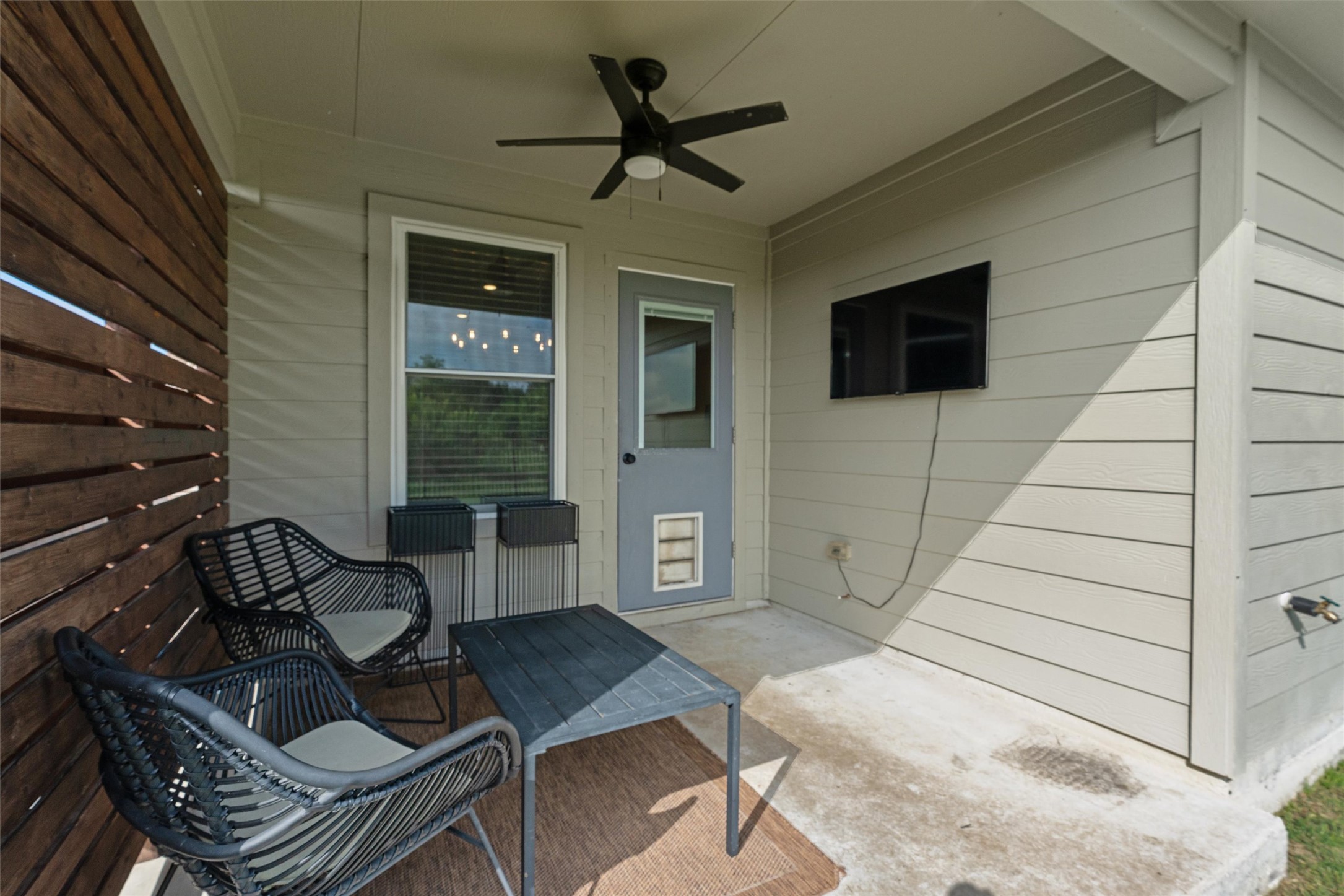 19912 Abigail Fillmore Road Manor, TX 78653 - Photo 23 of 31 Enjoy outdoor leisure on this inviting covered patio, complete with a ceiling fan for comfort.