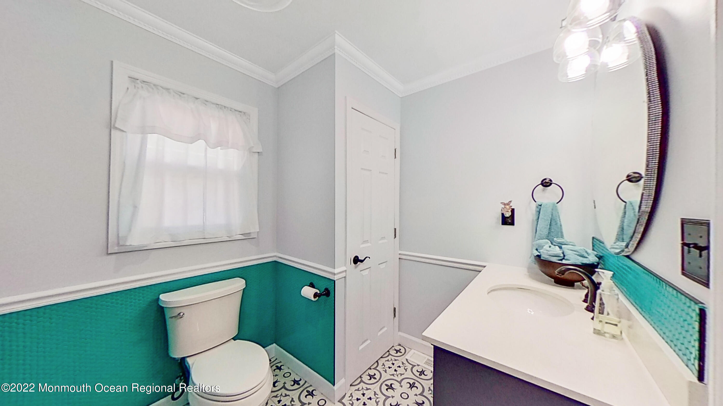 35 Oak Terrace Howell, NJ 07731 - Photo 11 of 27 a bathroom with a sink a toilet and mirror
