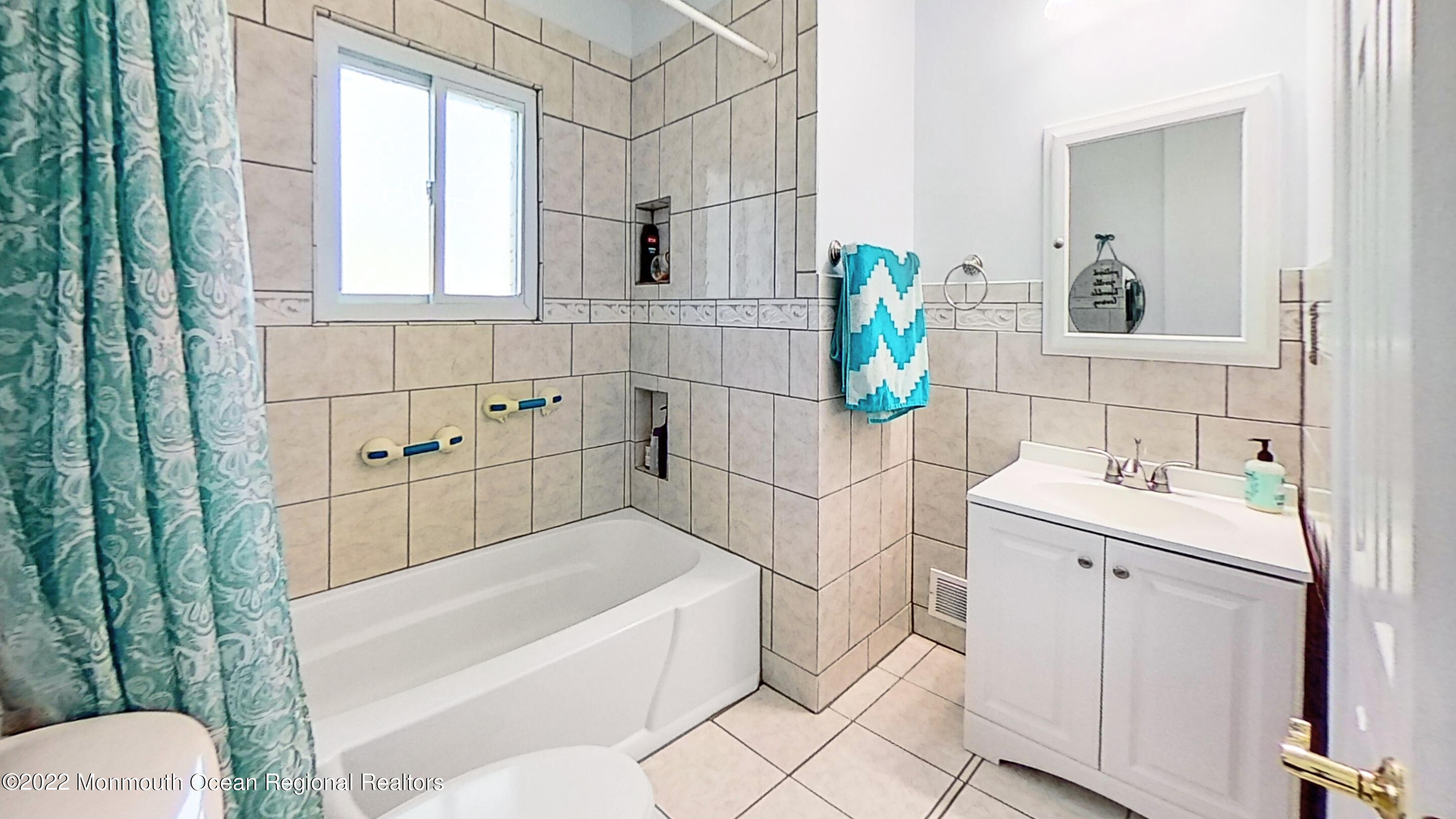 35 Oak Terrace Howell, NJ 07731 - Photo 15 of 27 a bathroom with a sink vanity mirror bathtub and toilet