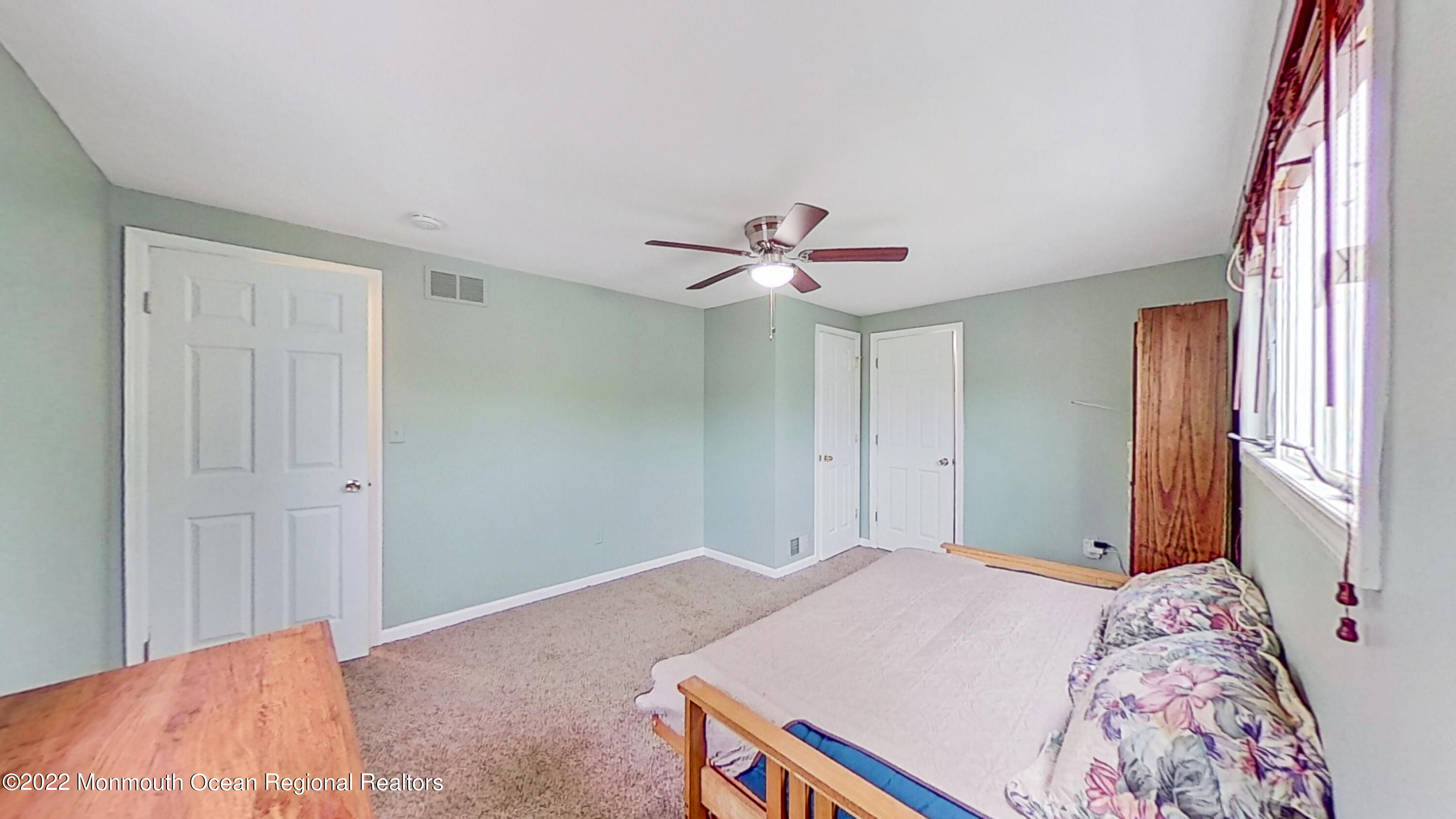 35 Oak Terrace Howell, NJ 07731 - Photo 17 of 27 a bedroom with a bed and a chandelier