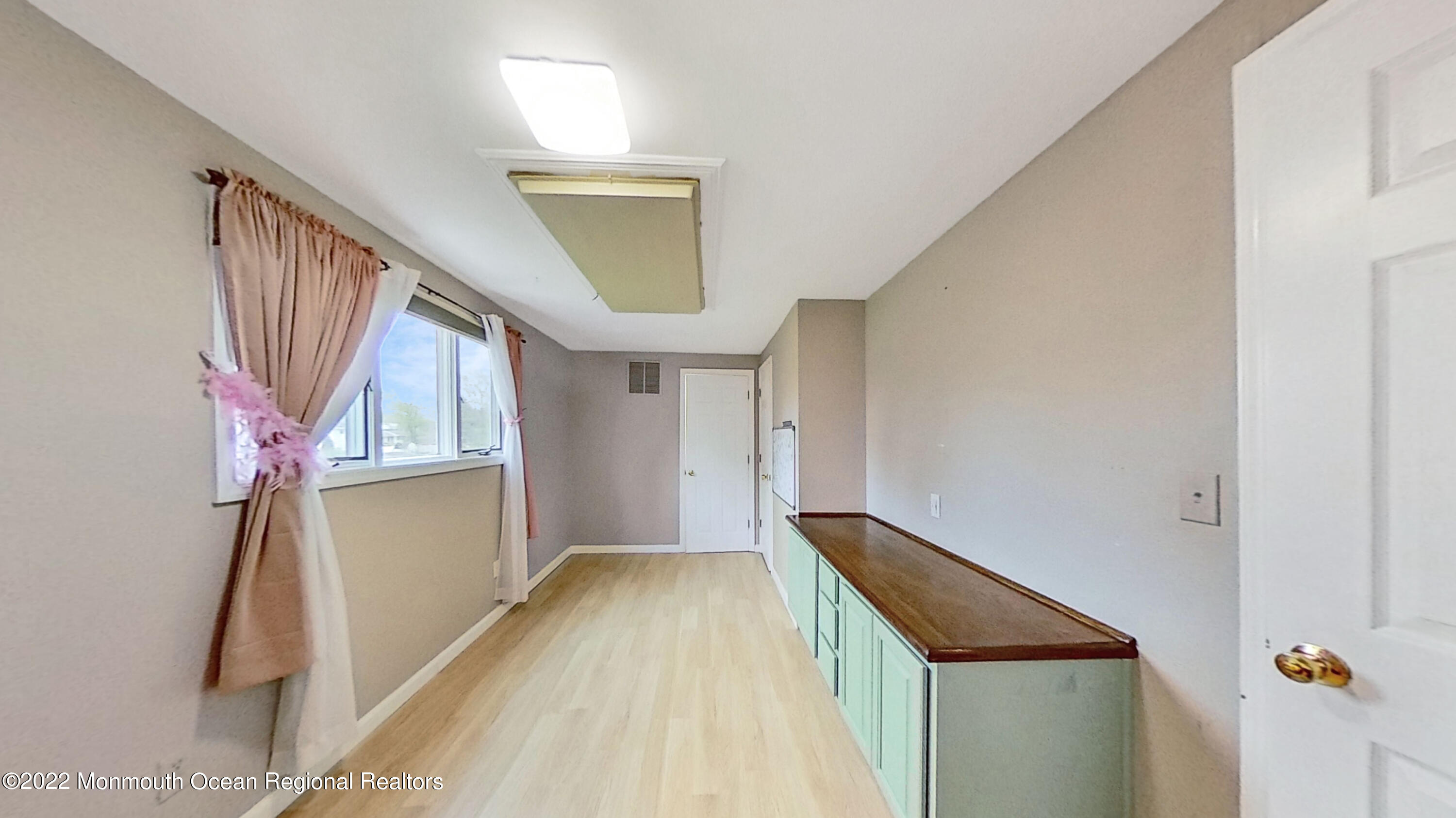 35 Oak Terrace Howell, NJ 07731 - Photo 19 of 27 a view of hallway with stairs and wooden floor
