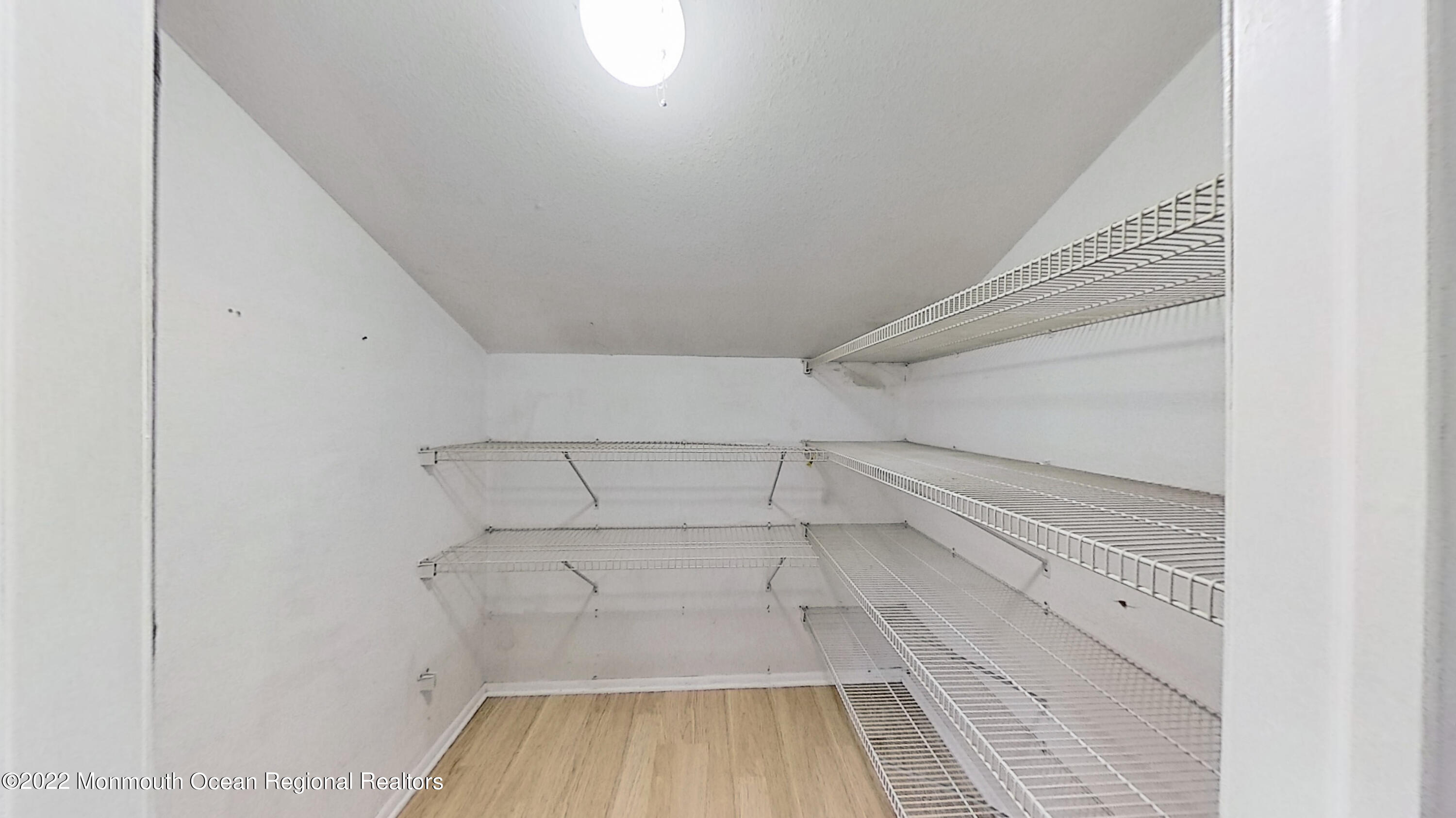 35 Oak Terrace Howell, NJ 07731 - Photo 21 of 27 a view of a room with racks on the wall