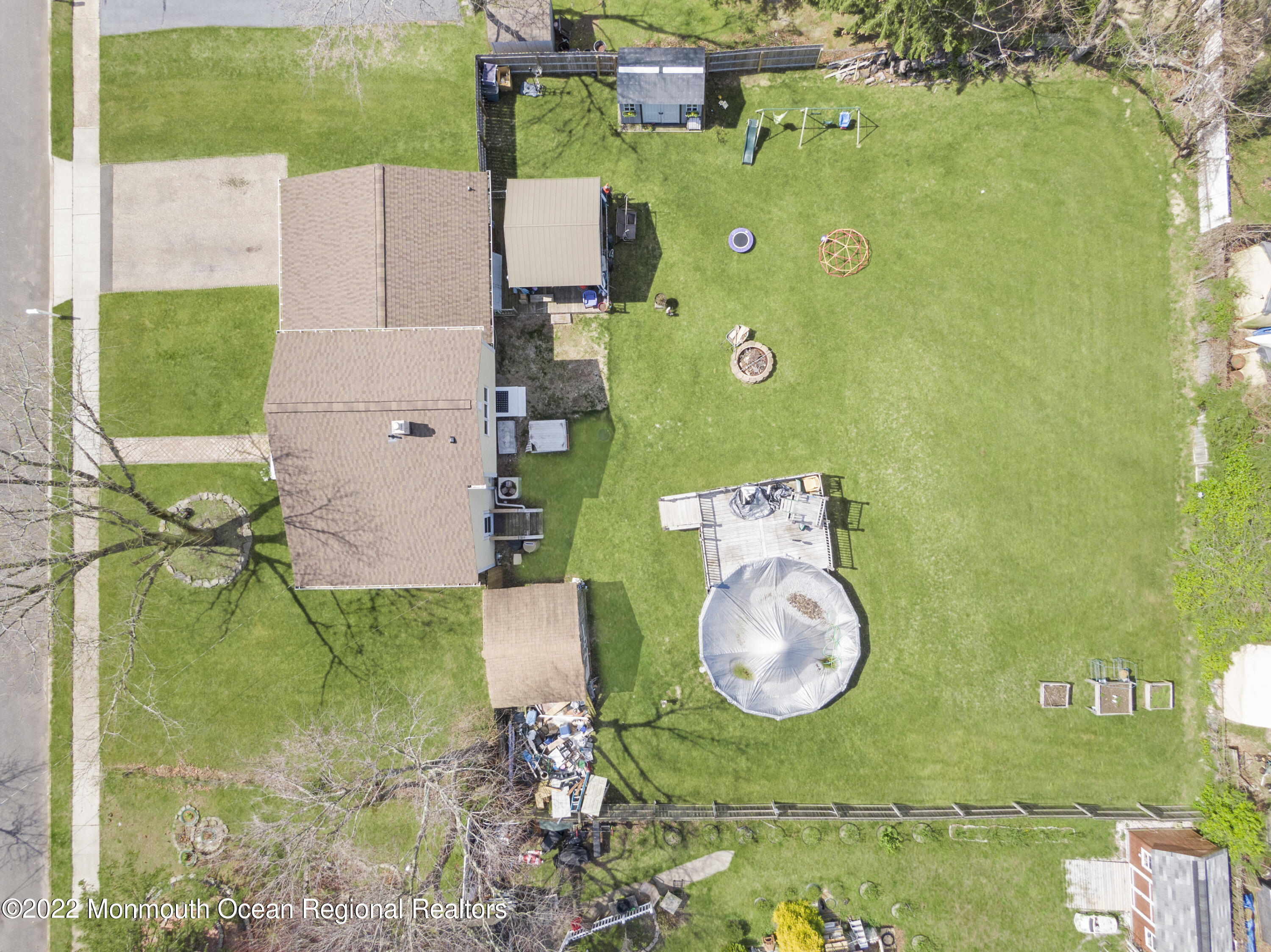 35 Oak Terrace Howell, NJ 07731 - Photo 25 of 27 an aerial view of a house with a swimming pool a yard and outdoor seating