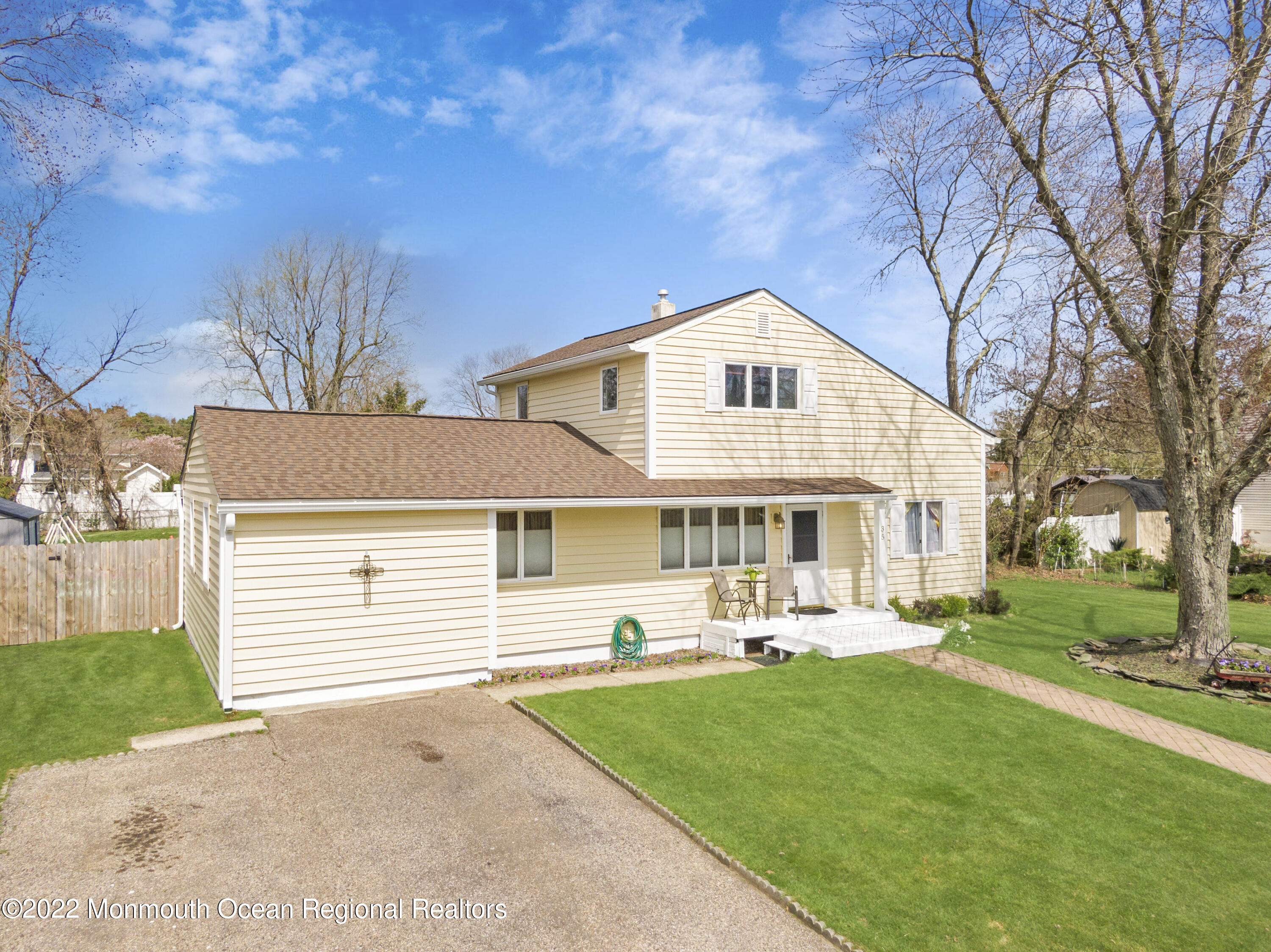 35 Oak Terrace Howell, NJ 07731 - Photo 26 of 27 a front view of a house with a yard