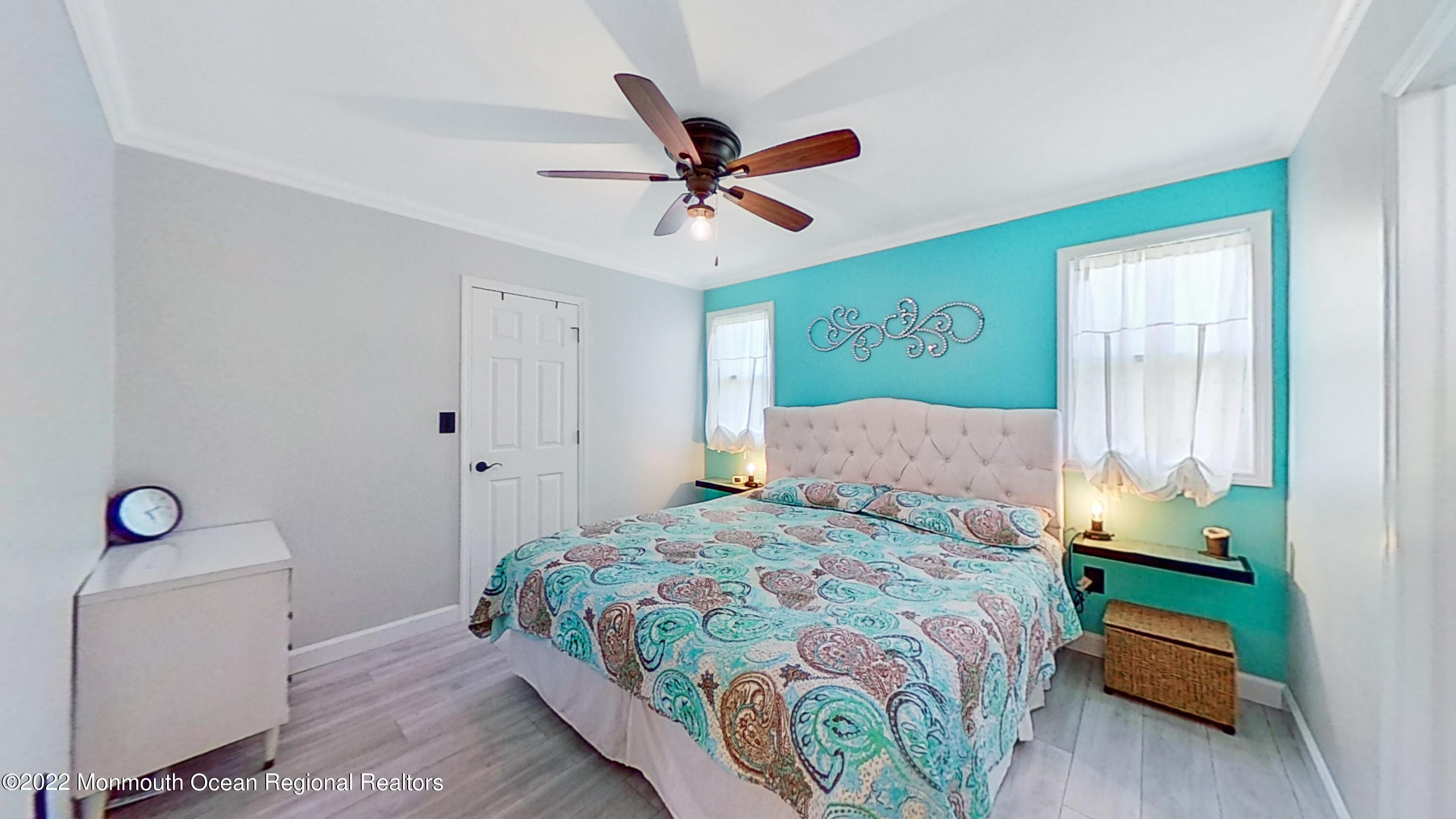 35 Oak Terrace Howell, NJ 07731 - Photo 7 of 27 a bedroom with a bed and a chandelier