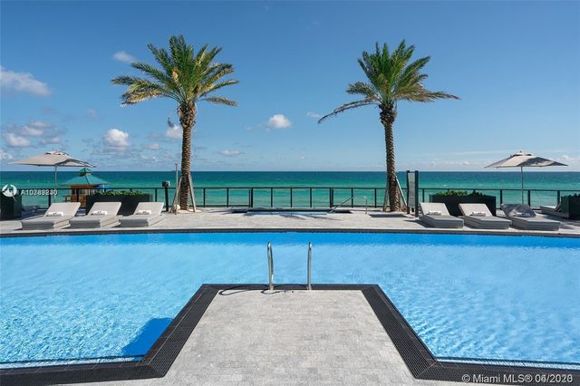 a view of a very nice looking living room with a large window