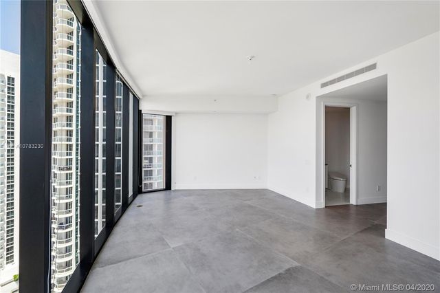 a kitchen with kitchen island a sink stainless steel appliances and cabinets