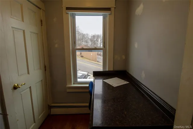 a bedroom with bed and window