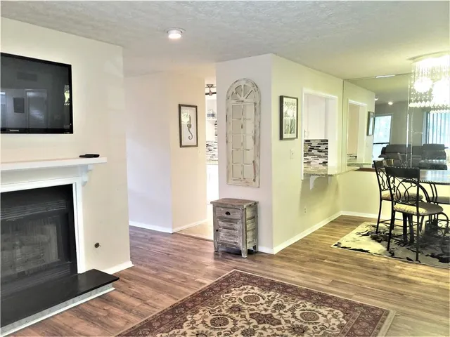 a view of a livingroom with furniture and a fireplace