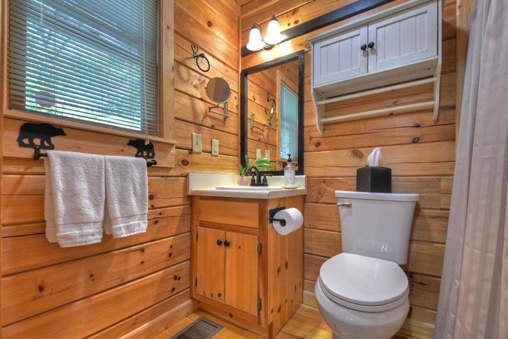 9 Joanna Court Blue Ridge, GA 30513 - Photo 18 of 34 a bathroom with a toilet and a sink