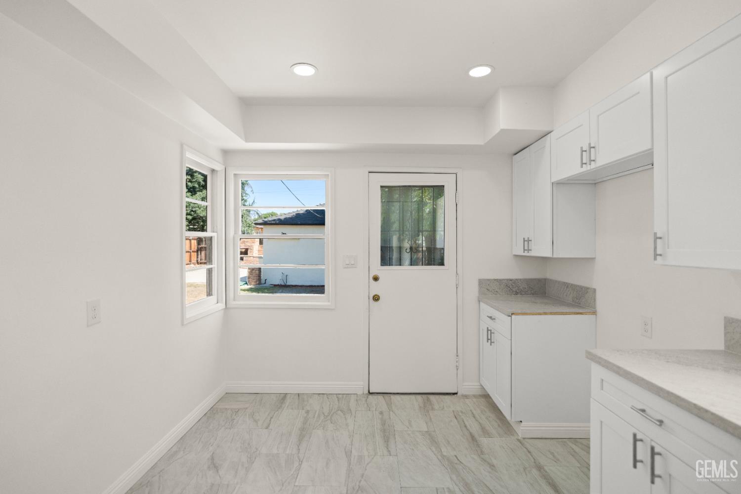 Undisclosed Address Bakersfield, CA 93305 - Photo 15 of 27 a view of kitchen with a sink cabinets and wooden floor