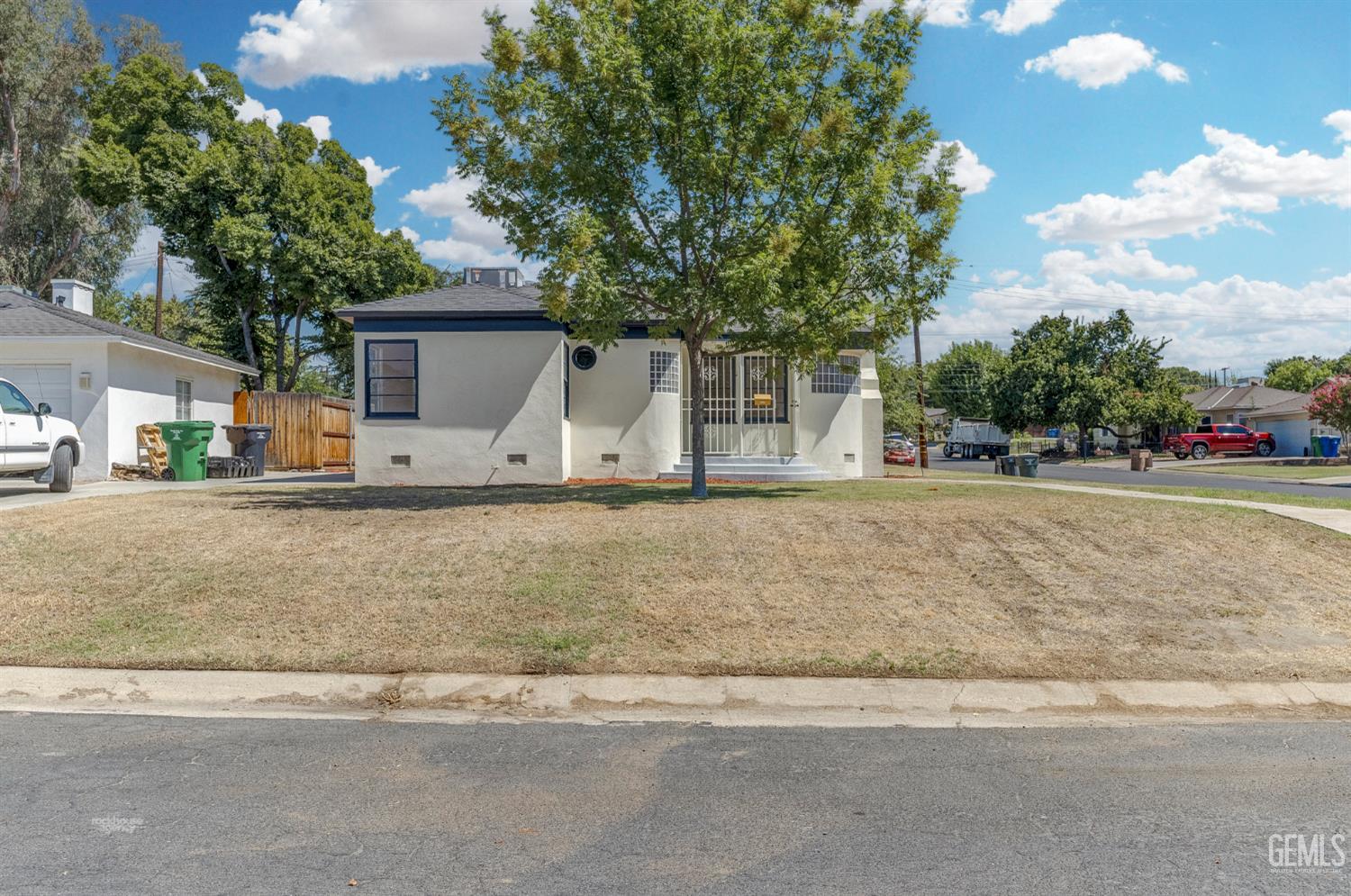 Undisclosed Address Bakersfield, CA 93305 - Photo 2 of 27 a house view with a garden space
