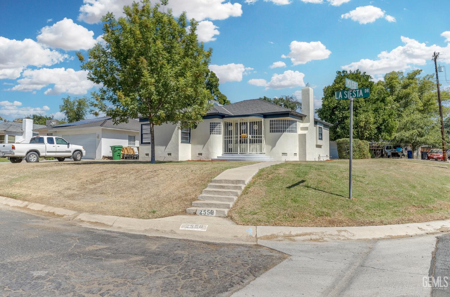 Undisclosed Address Bakersfield, CA 93305 - Photo 3 of 27 a view of multiple houses with a yard