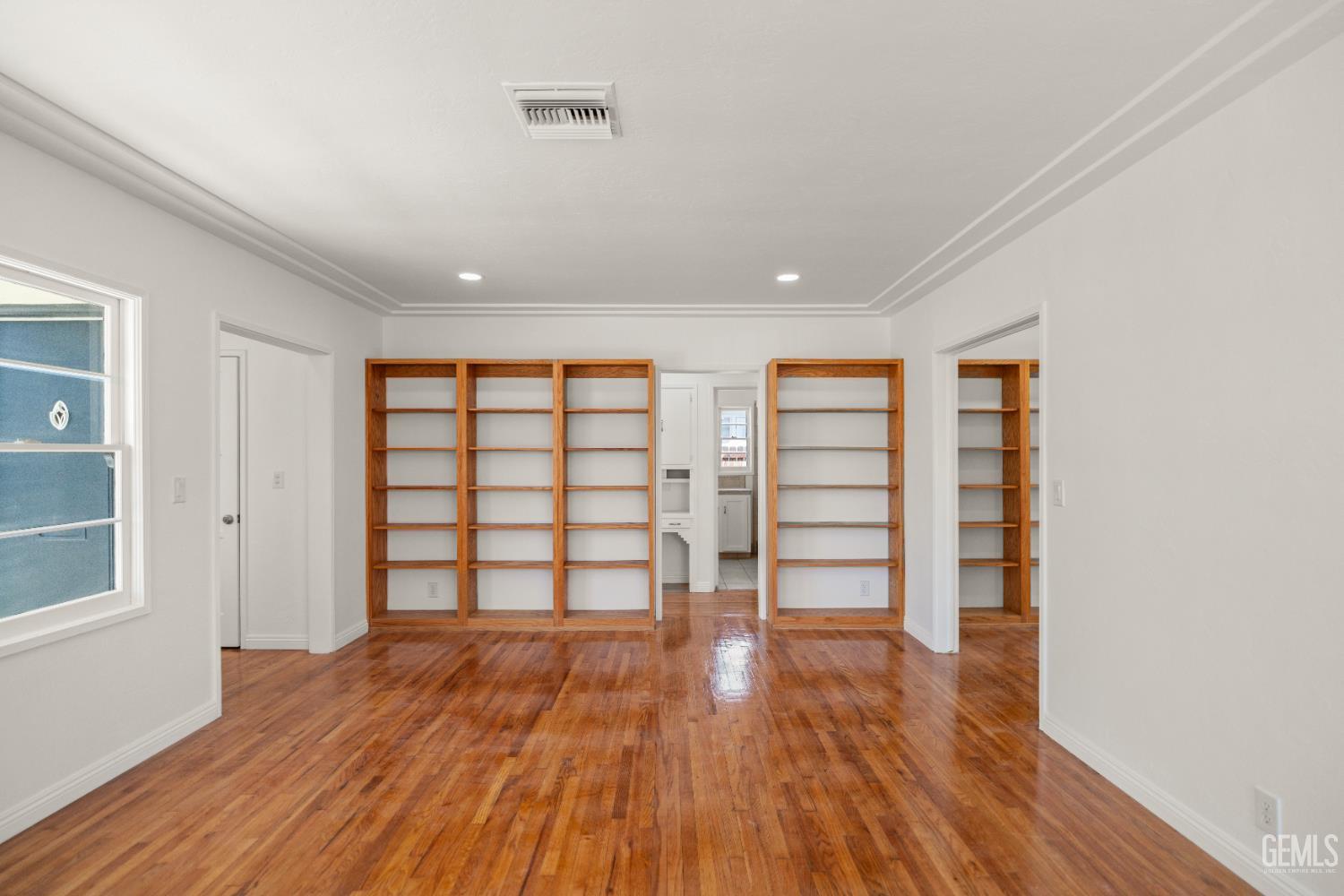 Undisclosed Address Bakersfield, CA 93305 - Photo 6 of 27 wooden floor in an empty room with a window