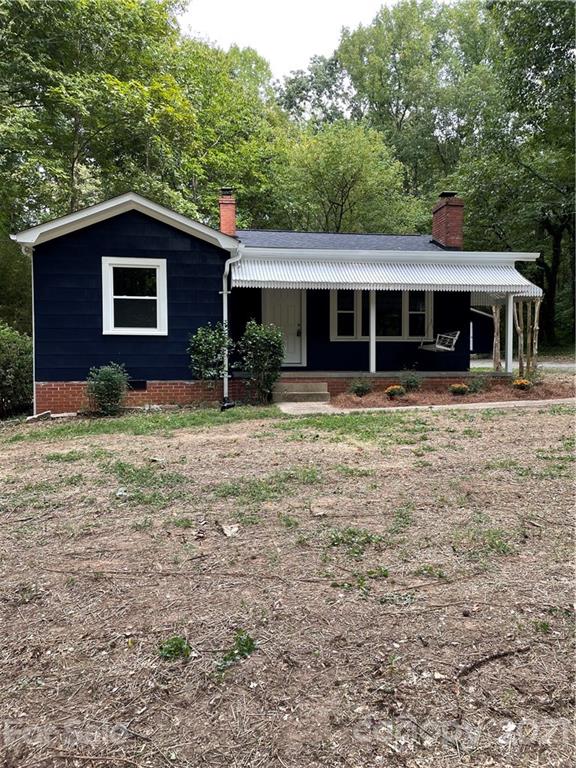 a house with trees in the background