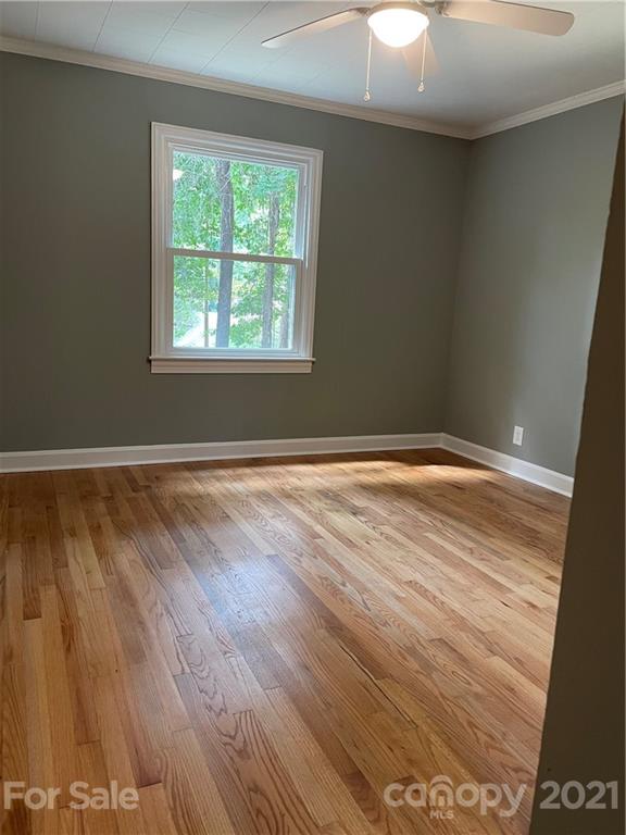 327 Ashbrook Road Salisbury, NC 28147 - Photo 11 of 27 wooden floor in an empty room with a window