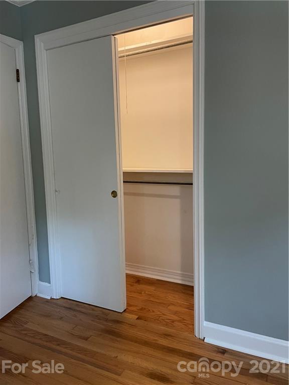327 Ashbrook Road Salisbury, NC 28147 - Photo 13 of 27 a view of an empty room with wooden floor