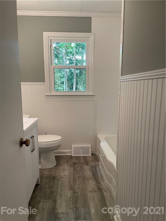 327 Ashbrook Road Salisbury, NC 28147 - Photo 15 of 27 a white toilet sitting next to a bathroom sink