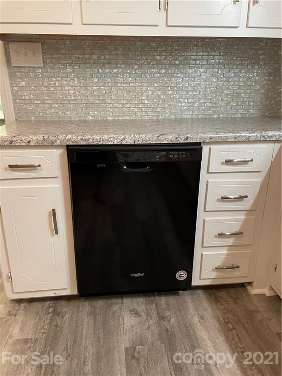 327 Ashbrook Road Salisbury, NC 28147 - Photo 7 of 27 a view of kitchen with granite countertop cabinets and black appliances