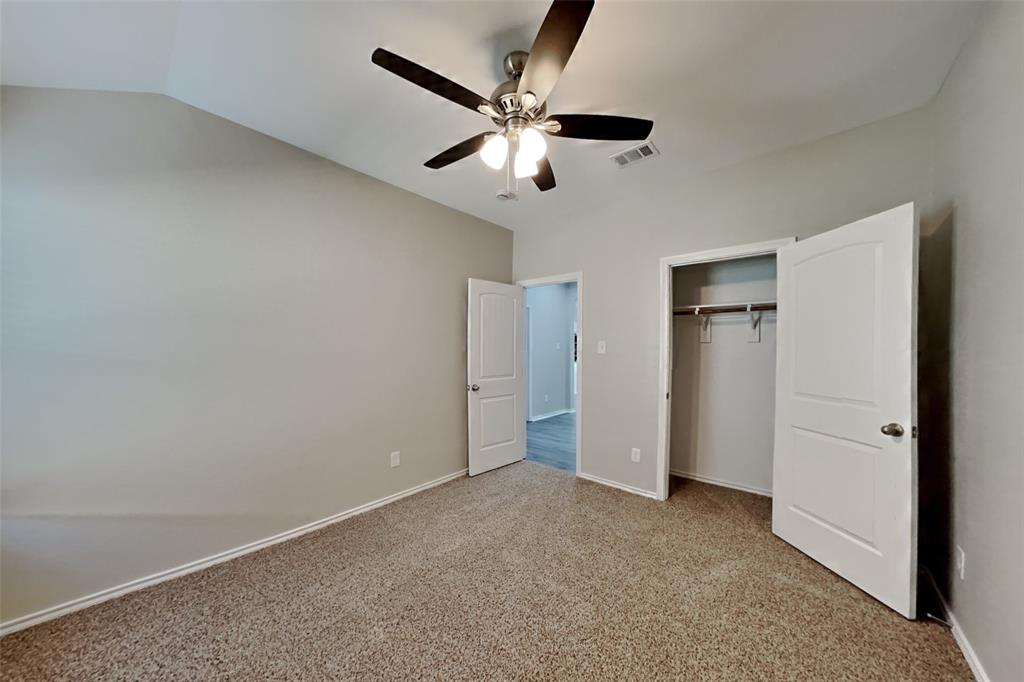 6285 Spring Buck Run Fort Worth, TX 76179 - Photo 13 of 18 an empty room with closet and ceiling fan