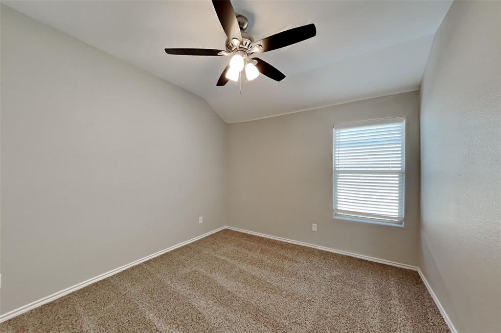 6285 Spring Buck Run Fort Worth, TX 76179 - Photo 14 of 18 an empty room with a window and a fan