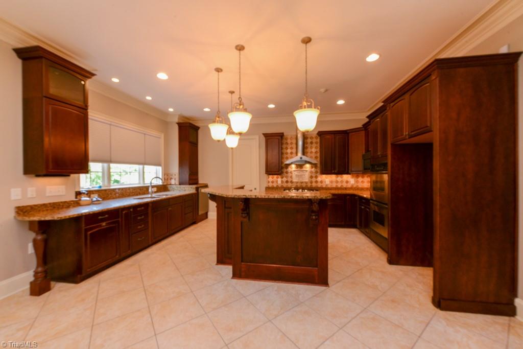 4229 Rock Bridge Road High Point, NC 27262 - Photo 16 of 49 Gourmet kitchen with gas range, double sinks, and double ovens