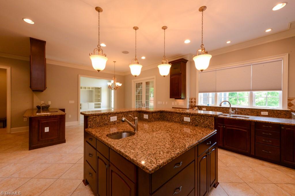 4229 Rock Bridge Road High Point, NC 27262 - Photo 20 of 49 Wonderful two tiered kitchen island with prep sink...bar area in the background