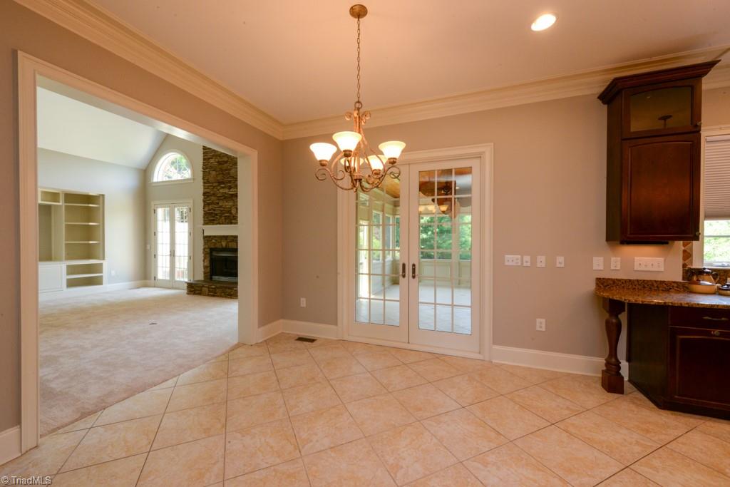 4229 Rock Bridge Road High Point, NC 27262 - Photo 22 of 49 Breakfast area leads to screened porch