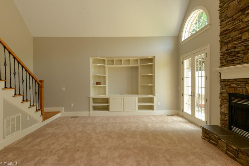 4229 Rock Bridge Road High Point, NC 27262 - Photo 23 of 49 Love this great room with second staircase and gas logs....high vaulted ceiling