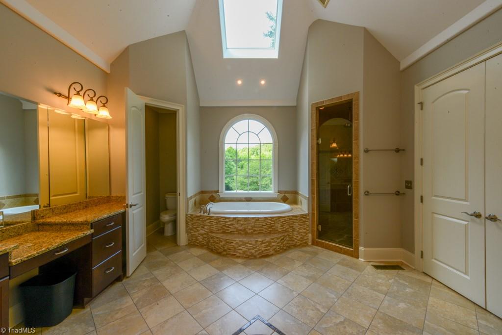4229 Rock Bridge Road High Point, NC 27262 - Photo 32 of 49 Nice soaker tub and shower...skylight brings in natural light