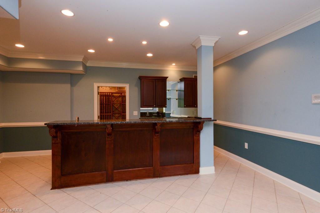 4229 Rock Bridge Road High Point, NC 27262 - Photo 42 of 49 Love this bar in the basement movie room..it opens to the wine cellar....wait til you see that!
