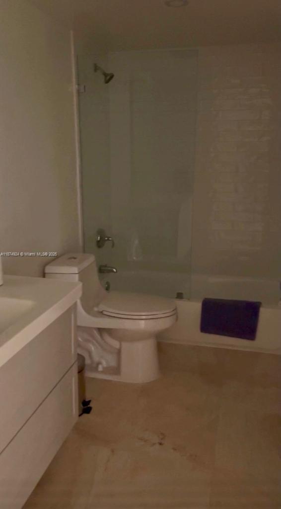 101 Crandon Boulevard, Unit 381 Key Biscayne, FL 33149 - Photo 15 of 16 a white toilet sitting next to a bath tub