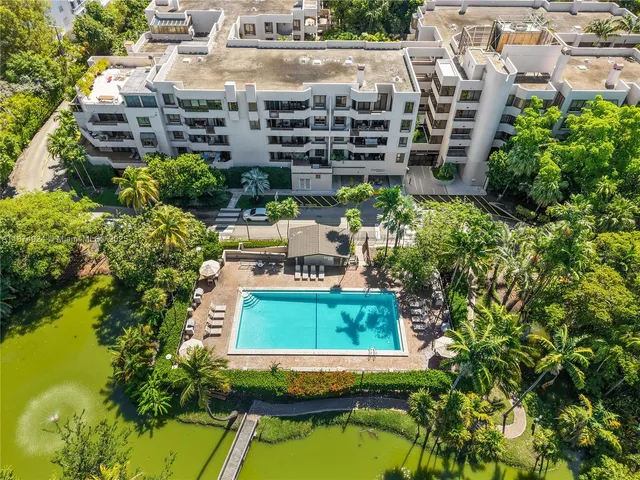 a small pool with tall buildings