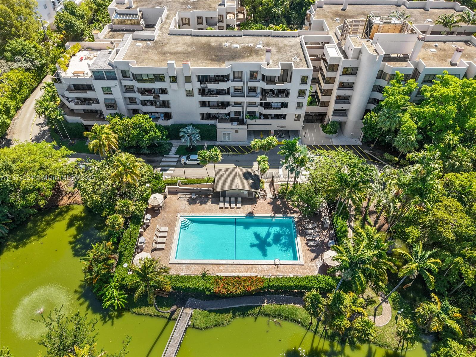 101 Crandon Boulevard, Unit 381 Key Biscayne, FL 33149 - Photo 2 of 16 a small pool with tall buildings