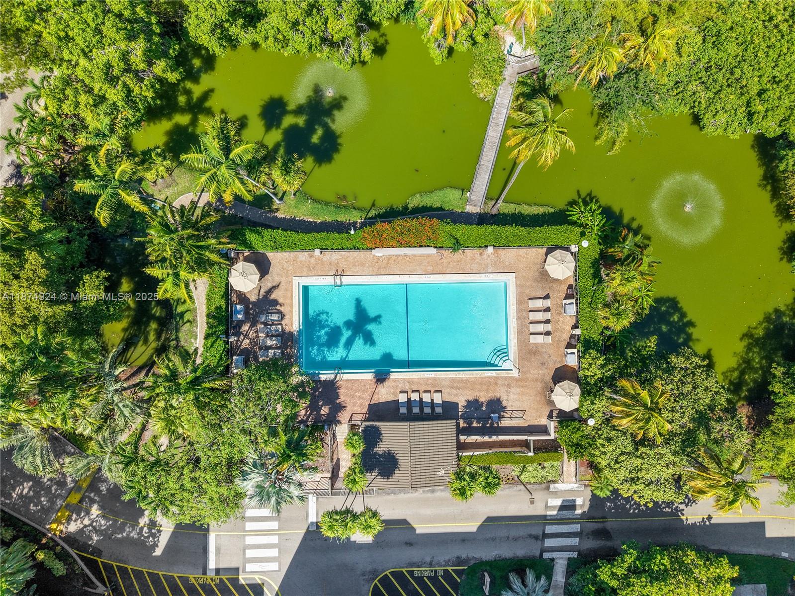 101 Crandon Boulevard, Unit 381 Key Biscayne, FL 33149 - Photo 3 of 16 a view of a table and chairs in patio