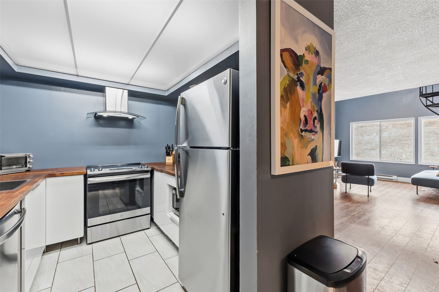 860 Copper Road, Unit 105 Copper Mountain, CO 80443 - Photo 7 of 27 a kitchen with stainless steel appliances granite countertop a refrigerator and a stove top oven