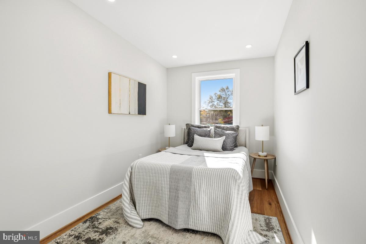 1621 D Street Northeast Washington, DC 20002 - Photo 20 of 31 a bedroom with a bed and painting on the wall