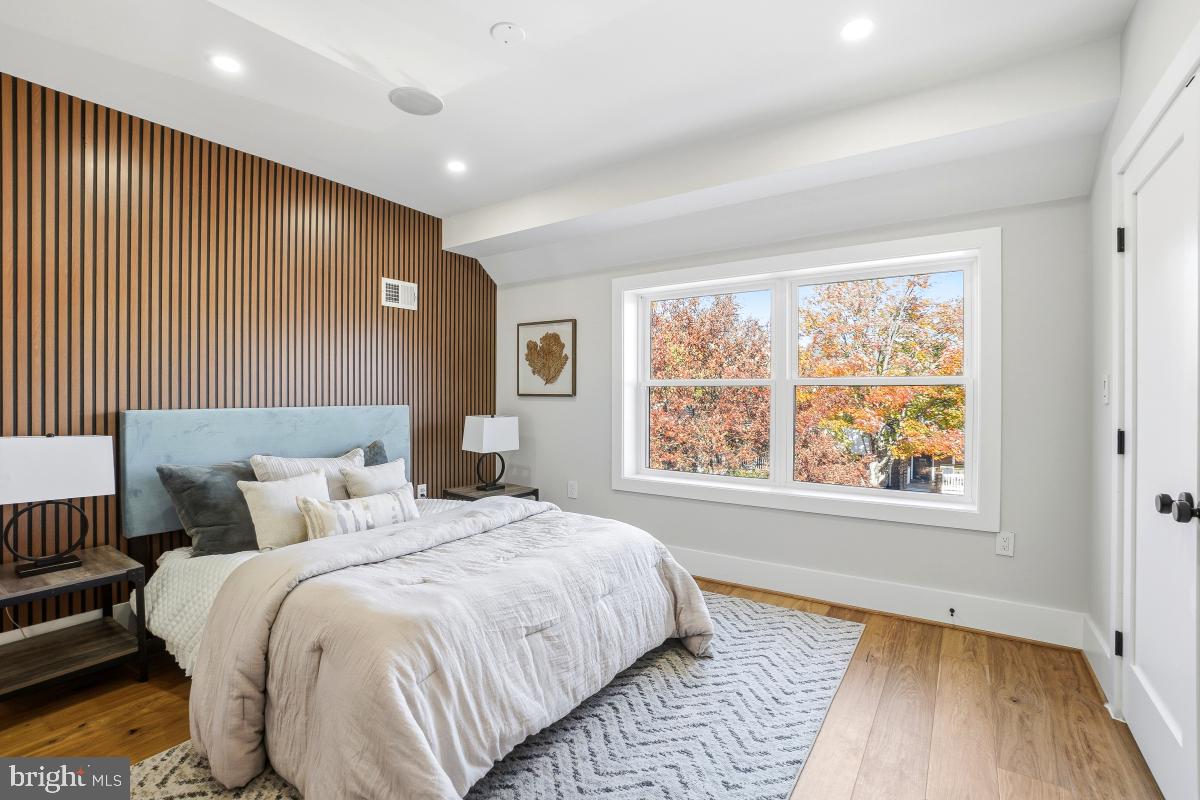 1621 D Street Northeast Washington, DC 20002 - Photo 21 of 31 a spacious bedroom with a large bed and a window