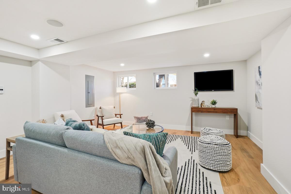 1621 D Street Northeast Washington, DC 20002 - Photo 24 of 31 a living room with furniture and a flat screen tv