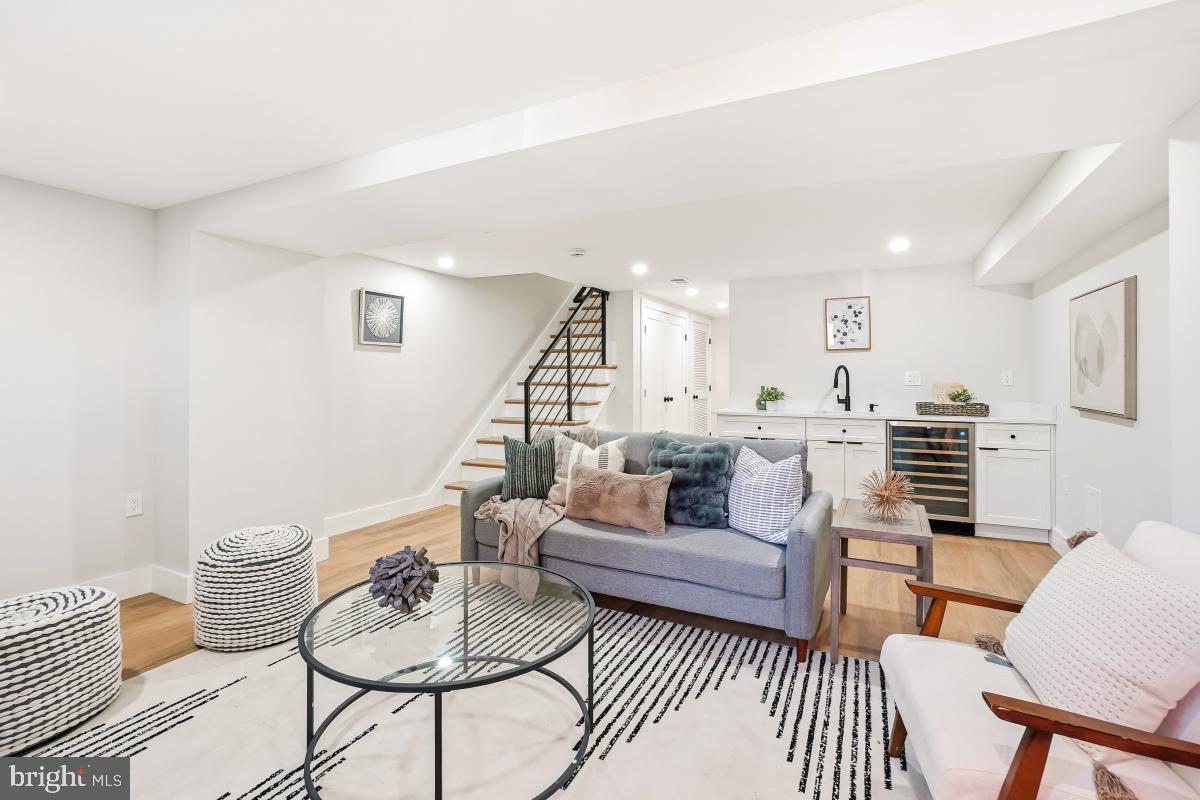 1621 D Street Northeast Washington, DC 20002 - Photo 25 of 31 a living room with furniture and a wooden floor