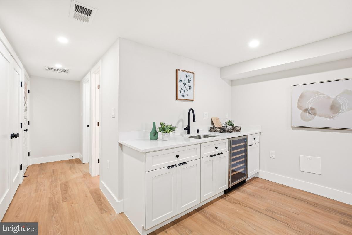 1621 D Street Northeast Washington, DC 20002 - Photo 26 of 31 a spacious bathroom with a double vanity sink and a mirror