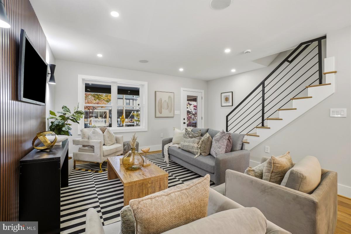 1621 D Street Northeast Washington, DC 20002 - Photo 5 of 31 a living room with furniture and a flat screen tv