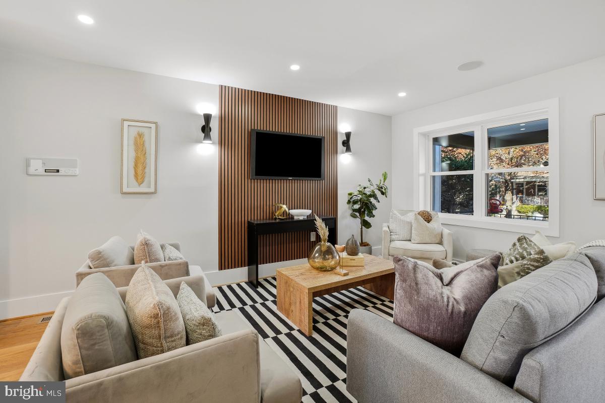 1621 D Street Northeast Washington, DC 20002 - Photo 6 of 31 a living room with furniture and a flat screen tv